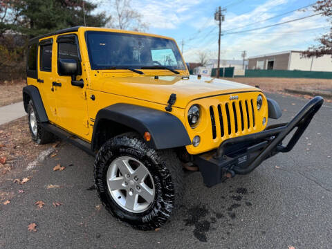 2015 Jeep Wrangler Unlimited for sale at International Motor Group LLC in Hasbrouck Heights NJ