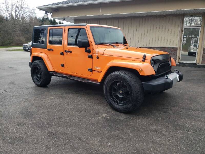 2012 Jeep Wrangler Unlimited for sale at RPM Auto Sales in Mogadore OH