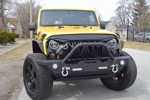 2011 Jeep Wrangler Unlimited for sale at QUEST AUTO GROUP LLC in Redford MI