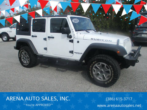 2014 Jeep Wrangler Unlimited for sale at ARENA AUTO SALES,  INC. in Holly Hill FL