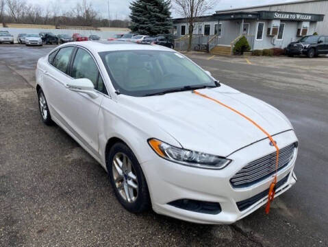 2013 Ford Fusion for sale at WELLER BUDGET LOT in Grand Rapids MI