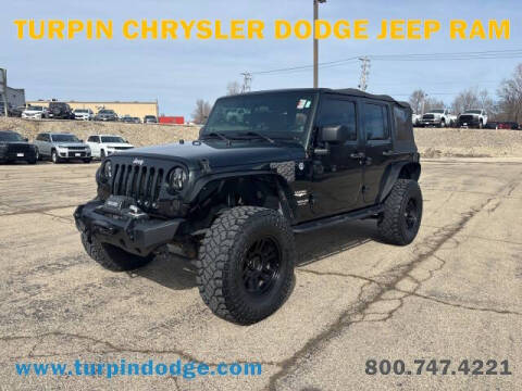 2012 Jeep Wrangler Unlimited for sale at Turpin Chrysler Dodge Jeep Ram in Dubuque IA