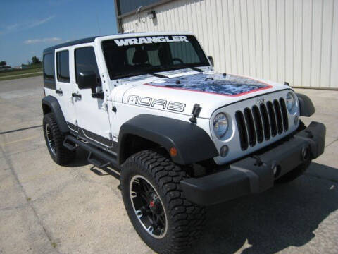 2016 Jeep Wrangler Unlimited for sale at FINNEY'S AUTO & TRUCK in Atlanta IN