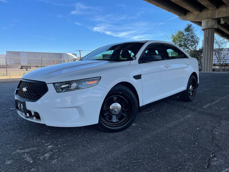2013 Ford Taurus for sale at MT Motor Group LLC in Phoenix AZ