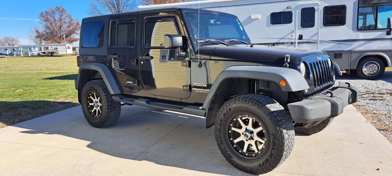 2014 Jeep Wrangler Unlimited for sale at CORNMAN AUTO LLC in Kirksville, MO