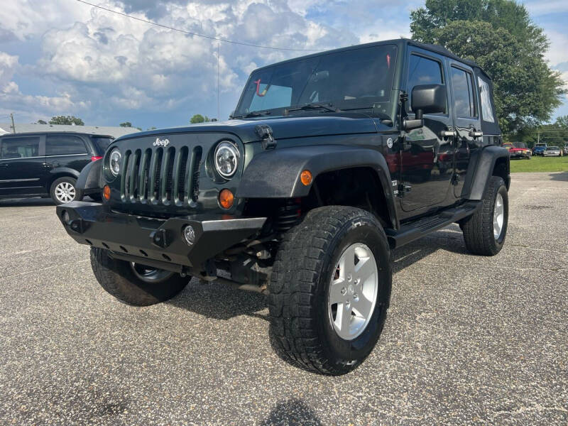 2012 Jeep Wrangler Unlimited for sale at Carworx LLC in Dunn NC