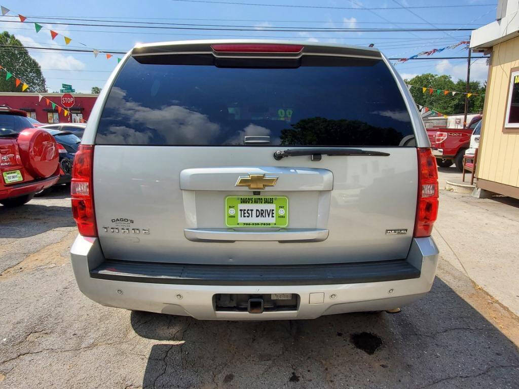 2011 Chevrolet Tahoe for sale at DAGO'S AUTO SALES LLC in Dalton, GA