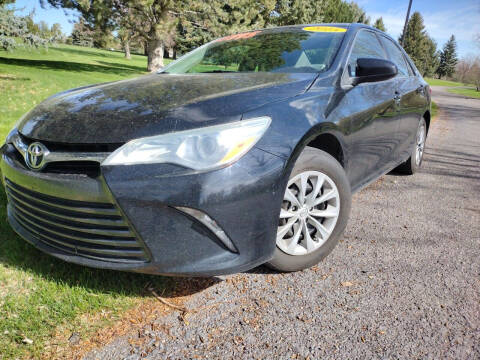 2015 Toyota Camry for sale at BELOW BOOK AUTO SALES in Idaho Falls ID