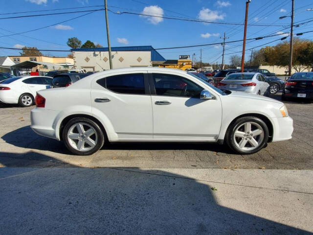 2013 Dodge Avenger for sale at DAGO'S AUTO SALES LLC in Dalton, GA