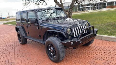 2012 Jeep Wrangler Unlimited for sale at PLATINUM CAR COMPANY in Detroit MI