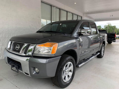 2013 Nissan Titan for sale at Powerhouse Automotive in Tampa FL