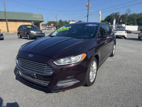 2013 Ford Fusion for sale at Cars for Less in Phenix City AL