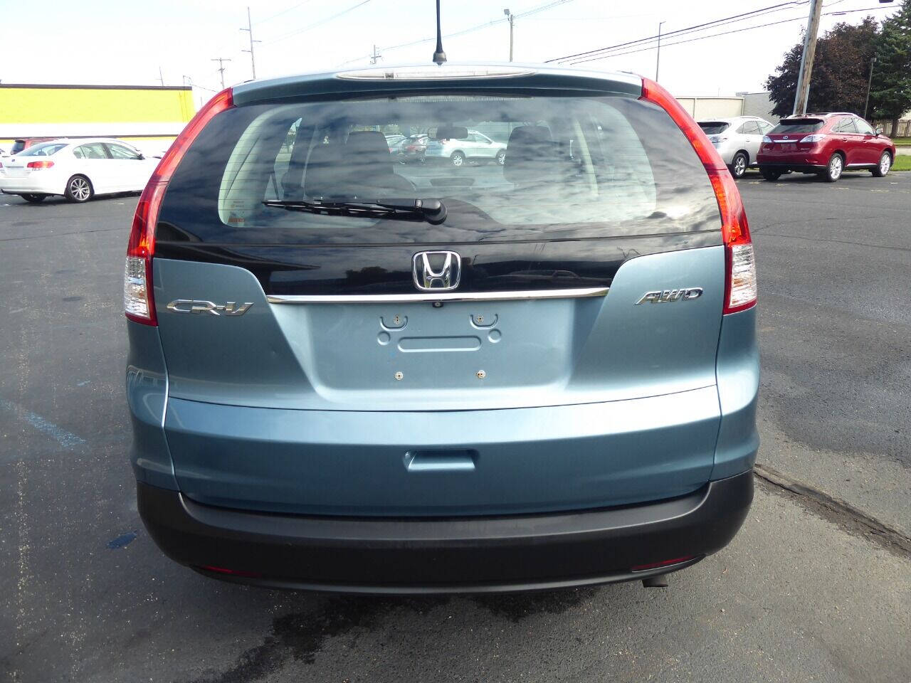 2014 Honda CR-V for sale at Lakeshore Autos in Holland, MI