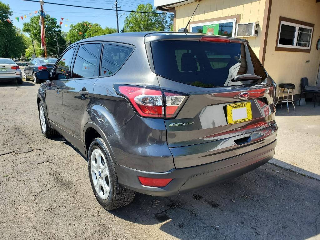 2017 Ford Escape for sale at DAGO'S AUTO SALES LLC in Dalton, GA