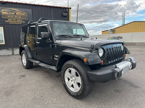 2012 Jeep Wrangler Unlimited for sale at BELOW BOOK AUTO SALES in Idaho Falls ID