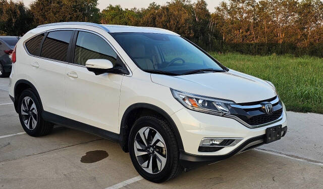 2015 Honda CR-V for sale at CAR MARKET AUTO GROUP in Sugar Land, TX