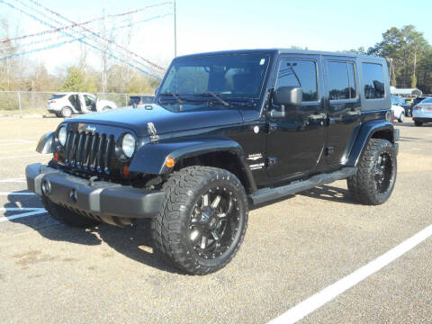 2010 Jeep Wrangler Unlimited for sale at STRAHAN AUTO SALES INC in Hattiesburg MS