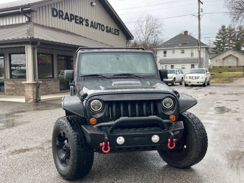 2013 Jeep Wrangler Unlimited for sale at Drapers Auto Sales in Peru IN