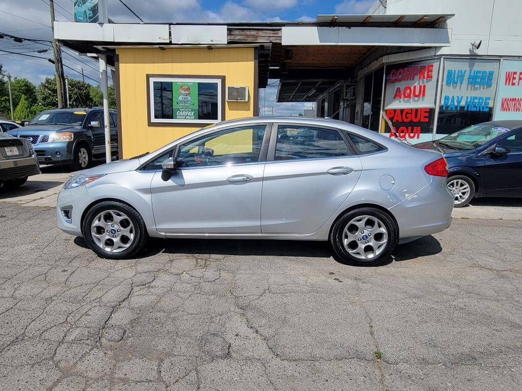 2013 Ford Fiesta for sale at DAGO'S AUTO SALES LLC in Dalton, GA