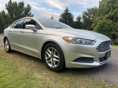 2013 Ford Fusion for sale at BELOW BOOK AUTO SALES in Idaho Falls ID