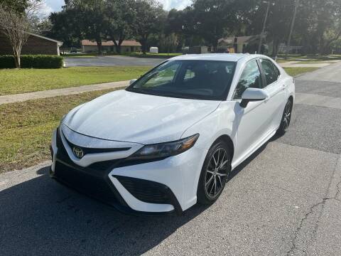 2021 Toyota Camry for sale at P J Auto Trading Inc in Orlando FL