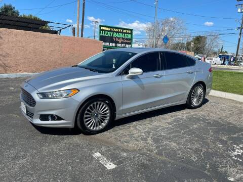 2014 Ford Fusion for sale at E and M Auto Sales in Bloomington CA