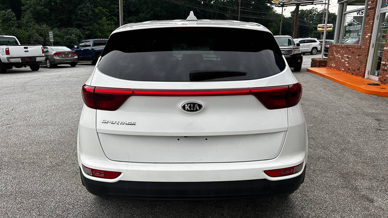 2017 Kia Sportage for sale at North Ridge Auto Center LLC in Madison, OH