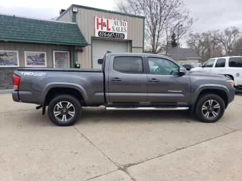 2016 Toyota Tacoma for sale at H & L AUTO SALES LLC in Wyoming MI