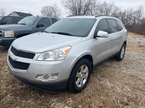 2012 Chevrolet Traverse for sale at HEDGES USED CARS in Carleton MI