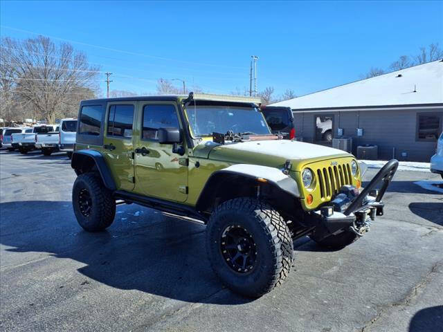 2010 Jeep Wrangler Unlimited for sale at HOWERTON'S AUTO SALES in Stillwater OK