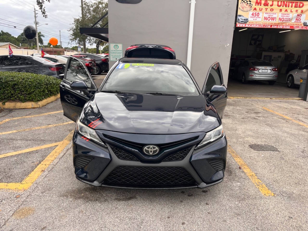 2019 Toyota Camry for sale at M & J UNITED AUTO SALES in LAUDERDALE LAKES, FL