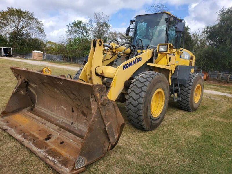 2009 Komatsu WA320-5L for sale at TEXAS MOTOR CARS in Houston TX