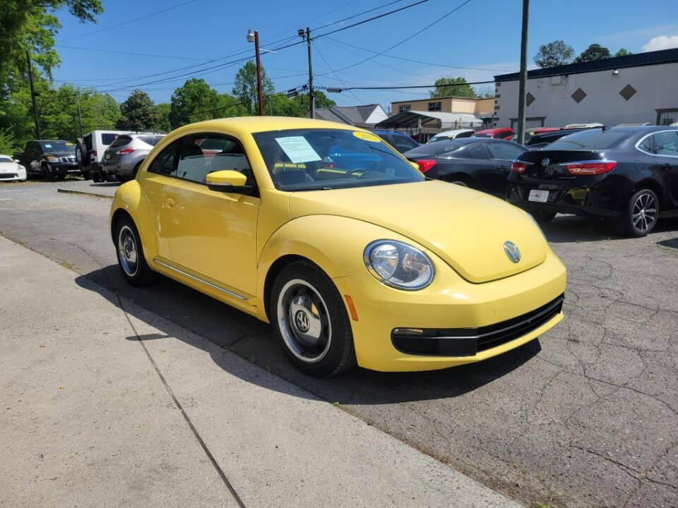 2012 Volkswagen Beetle for sale at DAGO'S AUTO SALES LLC in Dalton, GA