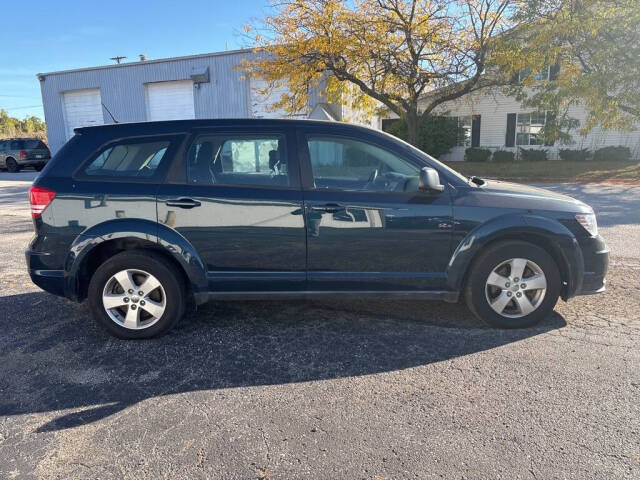 2014 Dodge Journey for sale at DECKER AUTO SALES in Bay City, MI