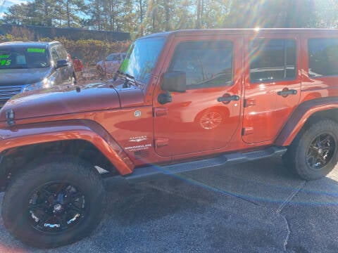 2014 Jeep Wrangler Unlimited for sale at TOP OF THE LINE AUTO SALES in Fayetteville NC