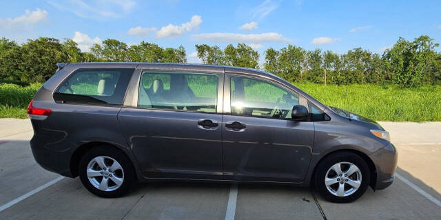 2014 Toyota Sienna for sale at CAR MARKET AUTO GROUP in Sugar Land, TX