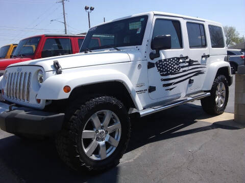 2012 Jeep Wrangler Unlimited for sale at Village Auto Outlet in Milan IL