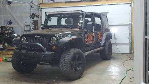 2011 Jeep Wrangler Unlimited for sale at A&R Auto Sales and Services LLC in Connersville IN