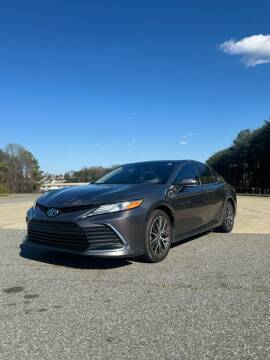 2021 Toyota Camry Hybrid for sale at Triple A's Motors in Greensboro NC