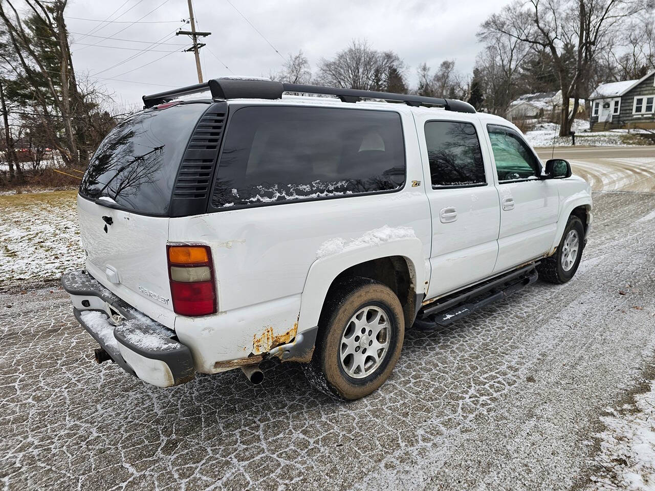 2003 Chevrolet Suburban for sale at WAGNER AUTO MART LLC in Ann Arbor, MI