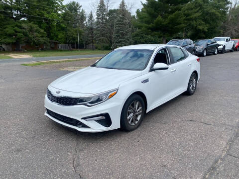 2019 Kia Optima for sale at Northstar Auto Sales LLC in Ham Lake MN