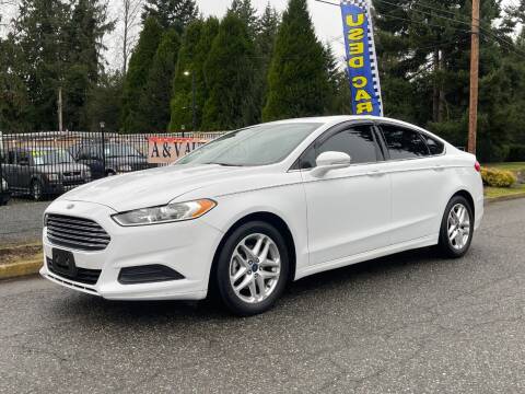 2014 Ford Fusion for sale at A & V AUTO SALES LLC in Marysville WA