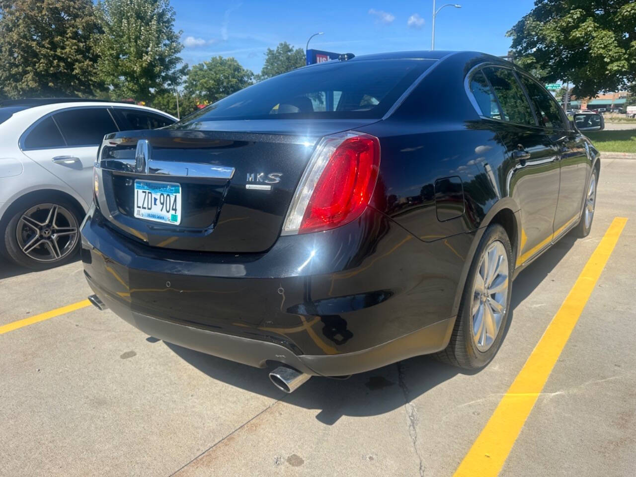 2011 Lincoln MKS for sale at JUST AUTOS in MINNEAPOLIS, MN