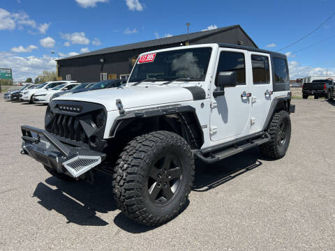 2013 Jeep Wrangler Unlimited for sale at BELOW BOOK AUTO SALES in Idaho Falls ID