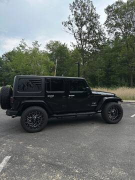 2016 Jeep Wrangler Unlimited for sale at Chris Nacos Auto Sales in Derry NH