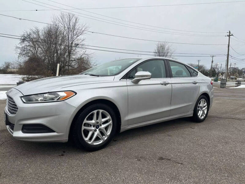 2013 Ford Fusion for sale at Glizzy Auto Sales in Barberton OH