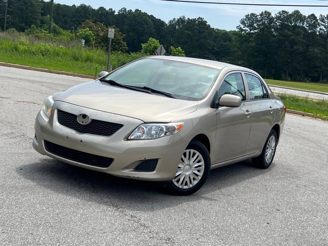 Gold 2010 Toyota Corolla LE LE 4dr Sedan 4A 1
