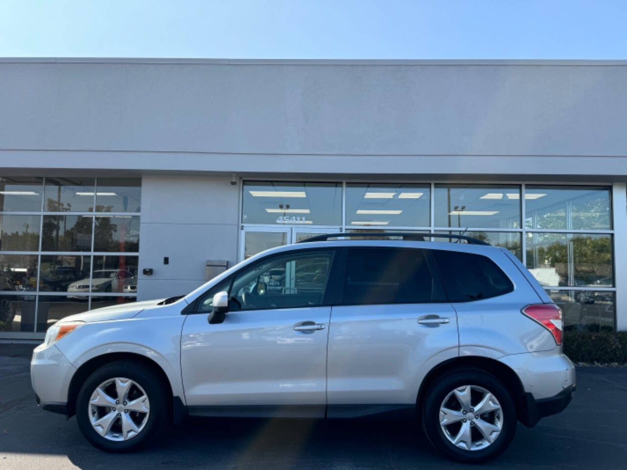 2015 Subaru Forester for sale at Opus Motorcars in Utica, MI