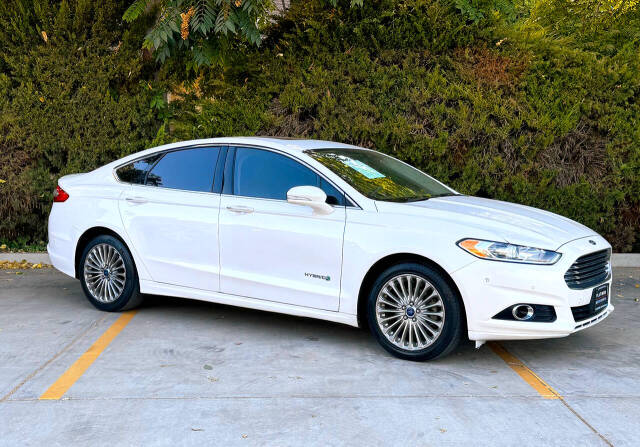 2014 Ford Fusion Hybrid for sale at Platinum motorsports in Patterson, CA