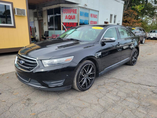 2013 Ford Taurus for sale at DAGO'S AUTO SALES LLC in Dalton, GA